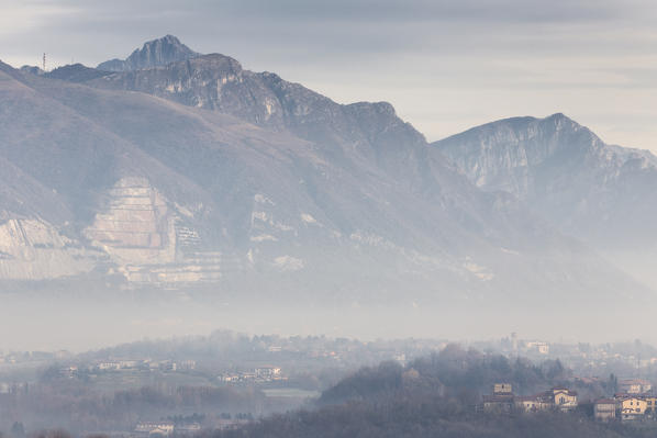 Foggy sunrise on Costamasnaga and Lecco mountains, Brianza, Lecco province, Lombardy, Italy, Europe