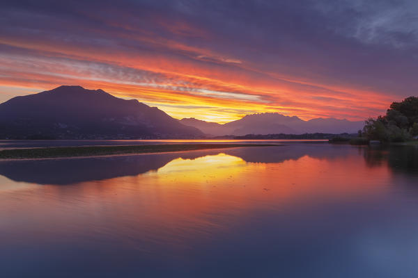 Lecco mountains on fire, sunrise on lake Pusiano, Lecco province, Brianza, Lombardy, Italy, Europe