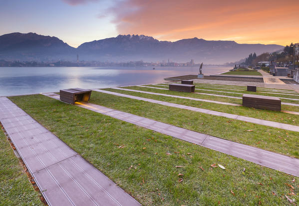 Sunrise on Lecco and mountains from Malgrate lakefront, lake Como, Lombardy, Italy, Europe