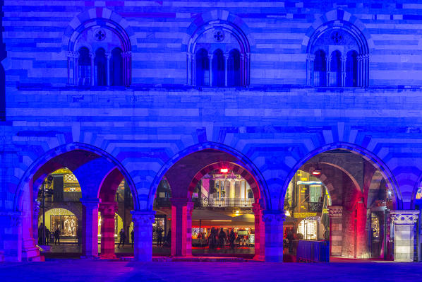 Arches of Broletto palace in Christmas time, Como, Lombardy, Italy, Europe