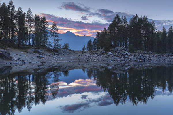 Sunset reflections on Lago Azzurro, Campodolcino, Spluga valley, Sondrio province, Lombardy, Italy, Europe