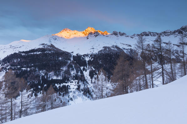 Pizzo Ferré and Pizzo dei Piani burning up at the first rays of sunrise, Spluga valley, Sondrio province, Lombardy, Italy, Europe