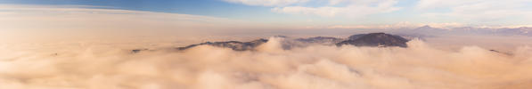 Panoramic of Spina Verde that rise up from a sea of clouds at sunrise, Como province, Lombardy, Italy, Europe