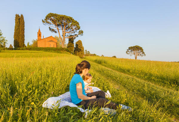 Mom with her daughter relax on Pomelasca meadows, Inverigo, Como province, Brianza, Lombardy, Italy, Europe (MR)