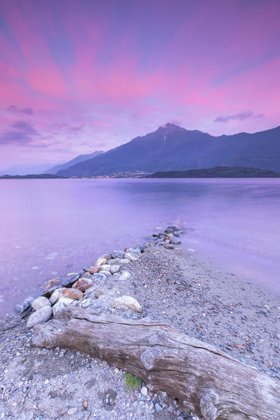 Pink sunset on Legnone mount from Domaso shore, lake Como, Como province, Lombardy, Italy, Europe