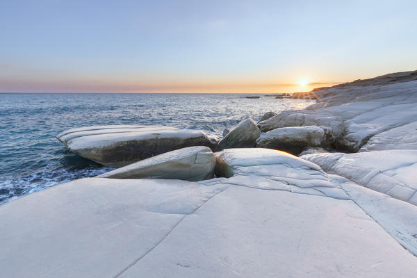 Cyprus, Limassol, The crystal water and the white rocks of Governor’s Beach at sunrise