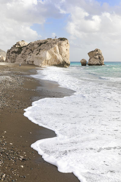 Cyprus, Paphos, Petra tou Romiou also known as Aphrodite’s Rock, boys standing over the rock
