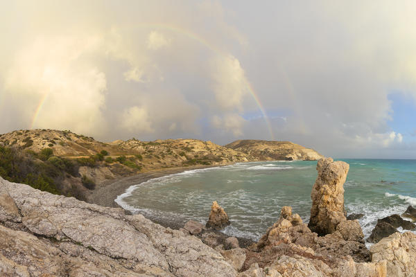 Cyprus, Paphos, rainbow at Petra tou Romiou also known as Aphrodite’s Rock 
