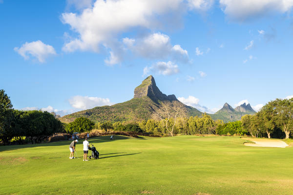 The golf course of the Tamarina Golf club with Rempart mountain in the background. Tamarin, Black River (Riviere Noir), Mauritius, Africa