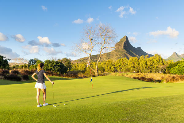 The golf course of the Tamarina Golf club with Rempart mountain in the background. Tamarin, Black River (Riviere Noir), Mauritius, Africa (MR)