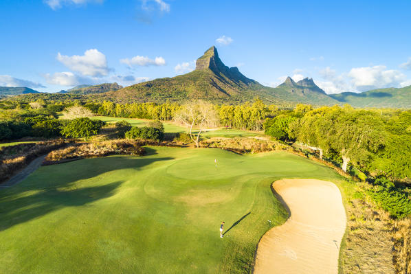 Aerial view of a woman playing golf. Tamarina golf club, Tamarin, Black River (Riviere Noir), Mauritius, Africa