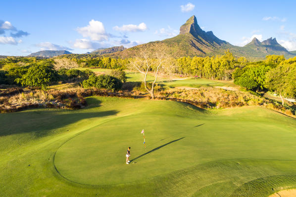 Aerial view of a woman playing golf. Tamarina golf club, Tamarin, Black River (Riviere Noir), Mauritius, Africa