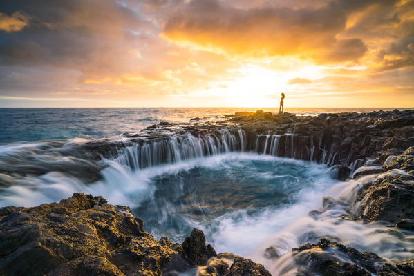 El Bufadero de La Garita, Province of Las Palmas, Gran Canaria, Canary Islands, Spain. A tourist admiring the view