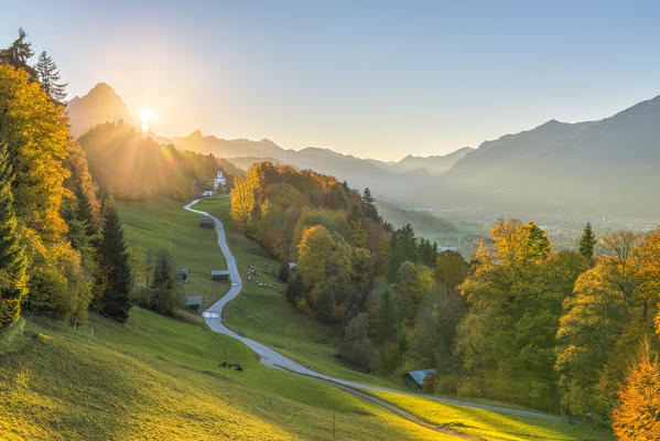 Wamberg, Garmisch Partenkirchen, Bavaria, Germany, Europe. Wamberg village at sunset with Zugspitze mountain in the background
