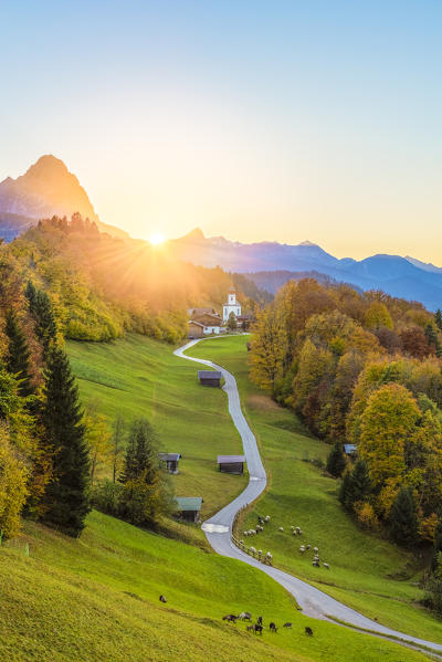 Wamberg, Garmisch Partenkirchen, Bavaria, Germany, Europe. Wamberg village at sunset with Zugspitze mountain in the background