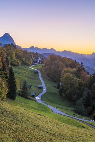 Wamberg, Garmisch Partenkirchen, Bavaria, Germany, Europe. Wamberg village at dusk. Garmisch Partenkirchen and Zugspitze mountain in the background