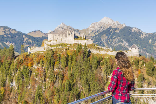 Reutte, Tyrol, Austria, Europe. Ehrenberg Castle and the Highline 179, the world’s longest pedestrian suspension bridge. A young woman admiring the view