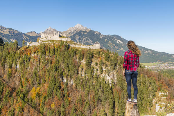 Reutte, Tyrol, Austria, Europe. Ehrenberg Castle and the Highline 179, the world’s longest pedestrian suspension bridge. A young woman admiring the view