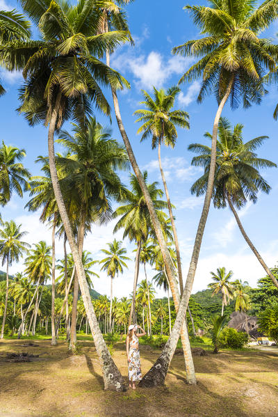 Woman exploring the Union Estate Plantation on La Digue island. La Digue, Seychelles, Africa (MR)
