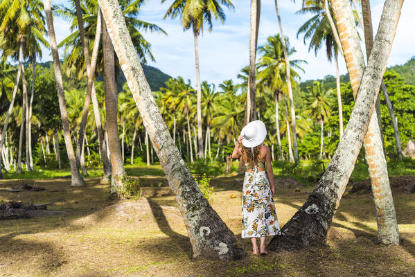 Woman exploring the Union Estate Plantation on La Digue island. La Digue, Seychelles, Africa