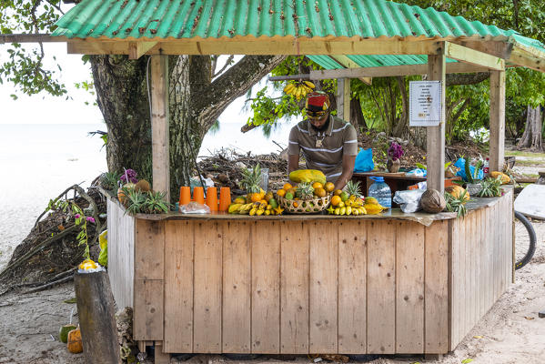 Beach stall selling fresh fruit drinks. La Digue, Seychelles, Africa