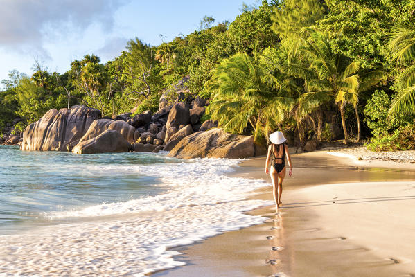 Beautiful woman walking on Anse Lazio beach, Praslin island, Seychelles, Africa (MR)