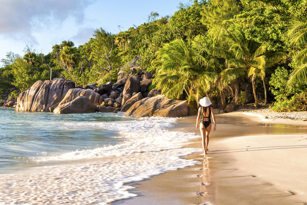 Beautiful woman walking on Anse Lazio beach, Praslin island, Seychelles, Africa (MR)