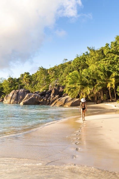 Beautiful woman walking on Anse Lazio beach, Praslin island, Seychelles, Africa (MR)
