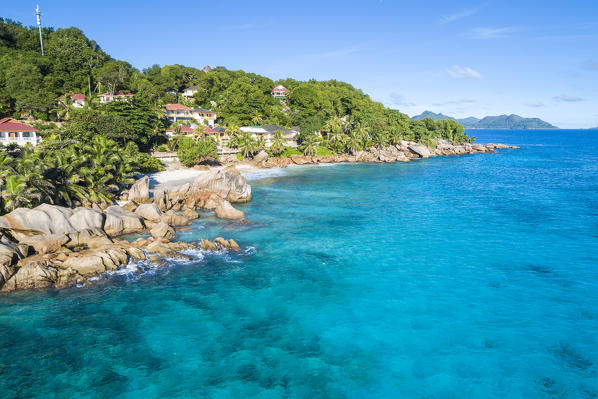 Aerial view of Anse Patates and Patatran village. La Digue island, Seychelles, Africa