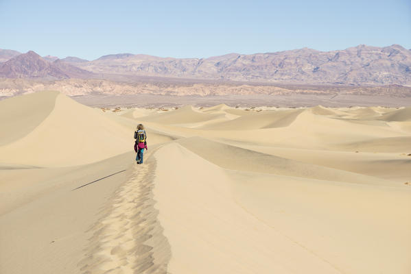 Hiking up Mesquite Flat Sand Dunes at Death Valley National Park, Inyo County, California, North America, USA