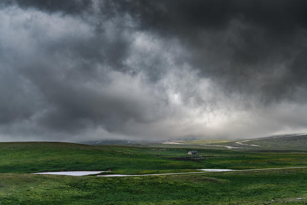 Shepherd's hut before the storm, Campo Imperatore, L'Aquila province, Abruzzo, Italy, Europe