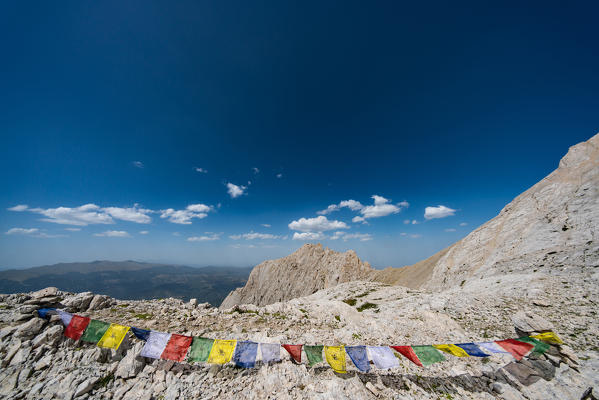 Tibetan prayer flags with Gran Sasso in background, Campo Imperatore, L'Aquila province, Abruzzo, Italy, Europe