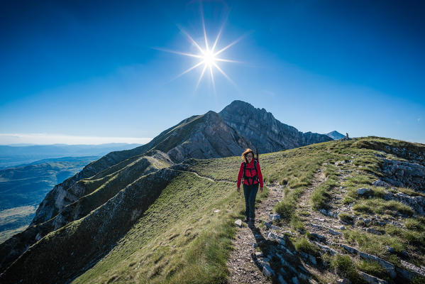 Trekker walking from Gran Sasso, Campo Imperatore, L'Aquila province, Abruzzo, Italy, Europe