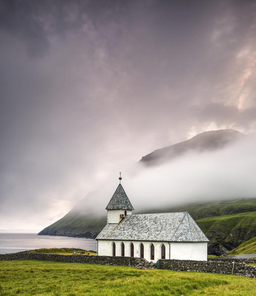 The church of Vidareidi at dusk, Vidoy Island, Faroe Island, Denmark, Europe