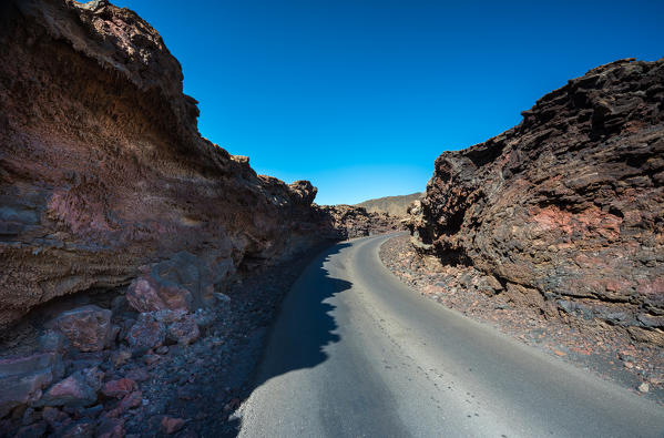 A road on the lava fields, Timanfaya National Park, Lanzarote, Canary island, Spain, Europe