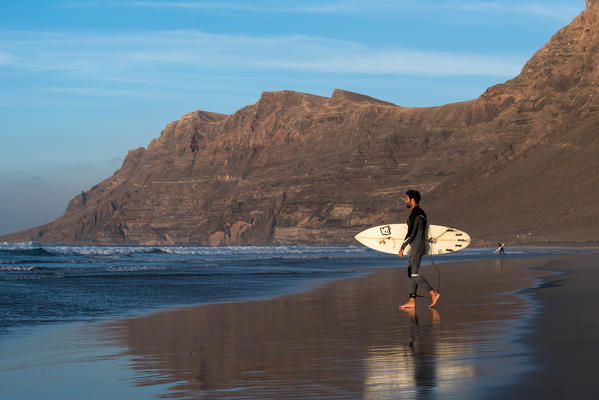 Surfer on Famara beach,  Lanzarote, Canary island, Spain, Europe