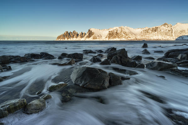 seascape with long exposure, with the Devil's teeth mountain in the background, Ersfjorden, Senja, Northern Norway, Europe.
