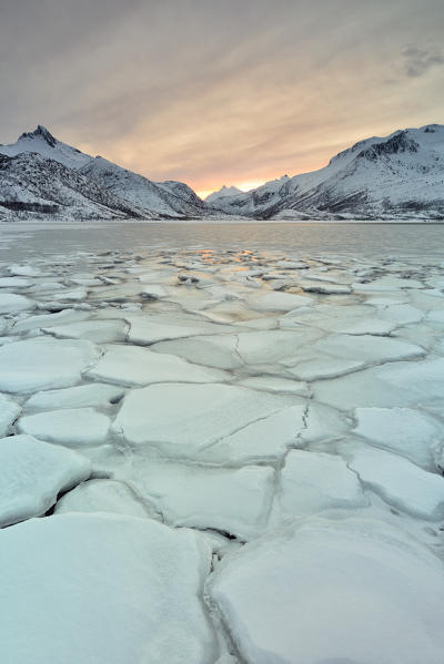 ice texture under a winter sunset around Svolvaer village, Austnesfjorden, Lofoten island, Northern Norway, Europe