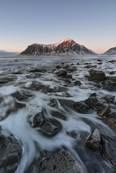 A magical sunset at Flakstad beach in winter day, Lofoten Islands, Northern Norway, Europe