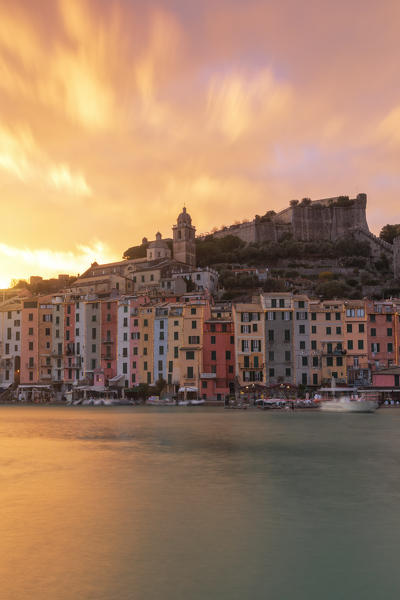 a fiery sunset over the medieval village of Portovenere during the Christmas holidays, UNESCO World Heritage Site, municipality of Portovenere, La Spezia province, Liguria district, Italy, Europe