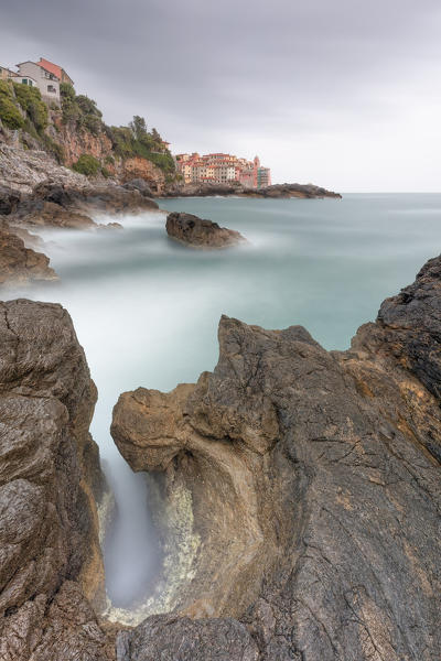 a long exposure to capture a cloudy sunset on the winding cliffs of Tellaro, municipality of Lerici, La Spezia province, Liguria district, Italy, Europe