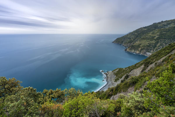 the colors of a spring sunset during a storm along the Cinque Terre coast, taken from a steep path, National Park of Cinque Terre, municipality of Riomaggiore, La Spezia province, Liguria district, Italy, Europe