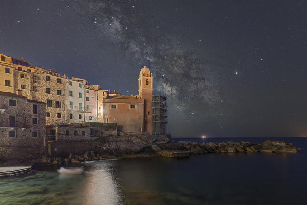 the milky way lights up the sky on summer nights above the church of San Giorgio at Tellaro, municipality of Lerici, La Spezia province, Liguria district, Italy, Europe
