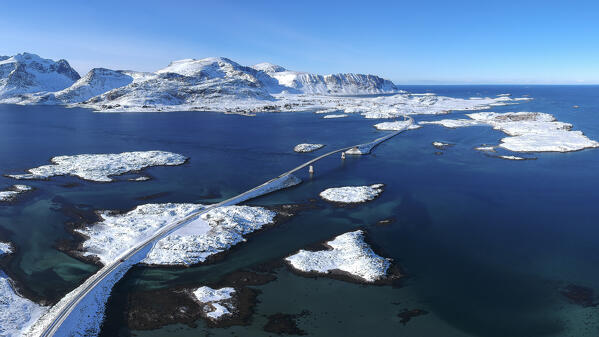 winter aerial view, taken by the drone, of the connecting bridge between Ramberg and Fredvang, Nordland, Lofoten Island, Norway, Europe
