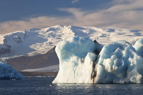 an iceberg in the Jokusarloon glacier lagoon during an autumn day, Iceland, Europe