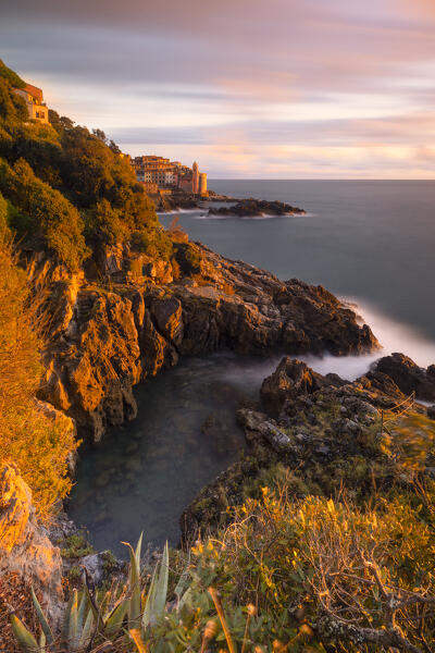a long exposure to capture the sunset light along the ligurian cliffs with the old village of Tellaro in background, Liguria, Italy, Europe