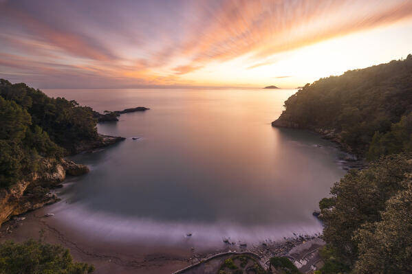 a long exposure to capture the sunset light along the ligurian cliffs with the Tino island in background, La Spezia province, Liguria, Italy, Europe