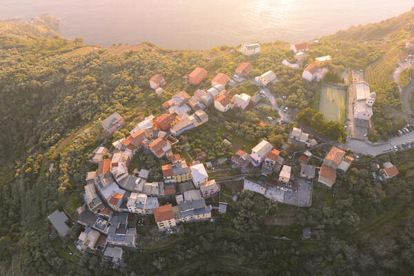 aerial view taken by drone of Volastra with Manarola in background, during a sunny day, La Spezia, Italy, Europe