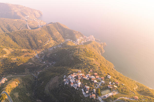 aerial view taken by drone of Volastra with Manarola in background, during a sunny day, La Spezia, Italy, Europe