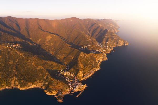 aerial vertical view taken by drone of Manarola, beautiful village of Cinque Terre, during a sunny day, La Spezia, Italy, Europe